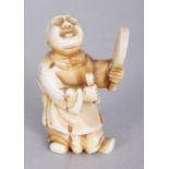 A SIGNED JAPANESE MEIJI PERIOD IVORY NETSUKE OF A STANDING BOY, with uplifted face and holding a