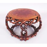 A FINE QUALITY 19TH CENTURY CHINESE CARVED HARDWOOD STAND, the top surface with an inset circular