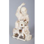 A JAPANESE MEIJI PERIOD IVORY OKIMONO OF AN ANIMATED MAN, quelling two demons, 2.8in high.