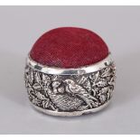 A NOVELTY SILVER BIRDS NESTING PIN CUSHION.