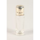 A VICTORIAN SILVER TOP GLASS SCENT BOTTLE. 7cms long. Birmingham1899.