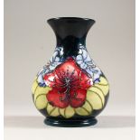 A VASE, with the hibiscus design, 1996. 6ins high.