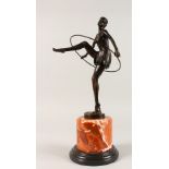 AFTER A. ALONZO. A BRONZE HOOP DANCER. Signed, on a marble base. 18ins high.