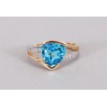 A 14CT WHITE AND YELLOW GOLD TWO TONE RING set with as trillion cut blue topaz approx. 3.23cts.