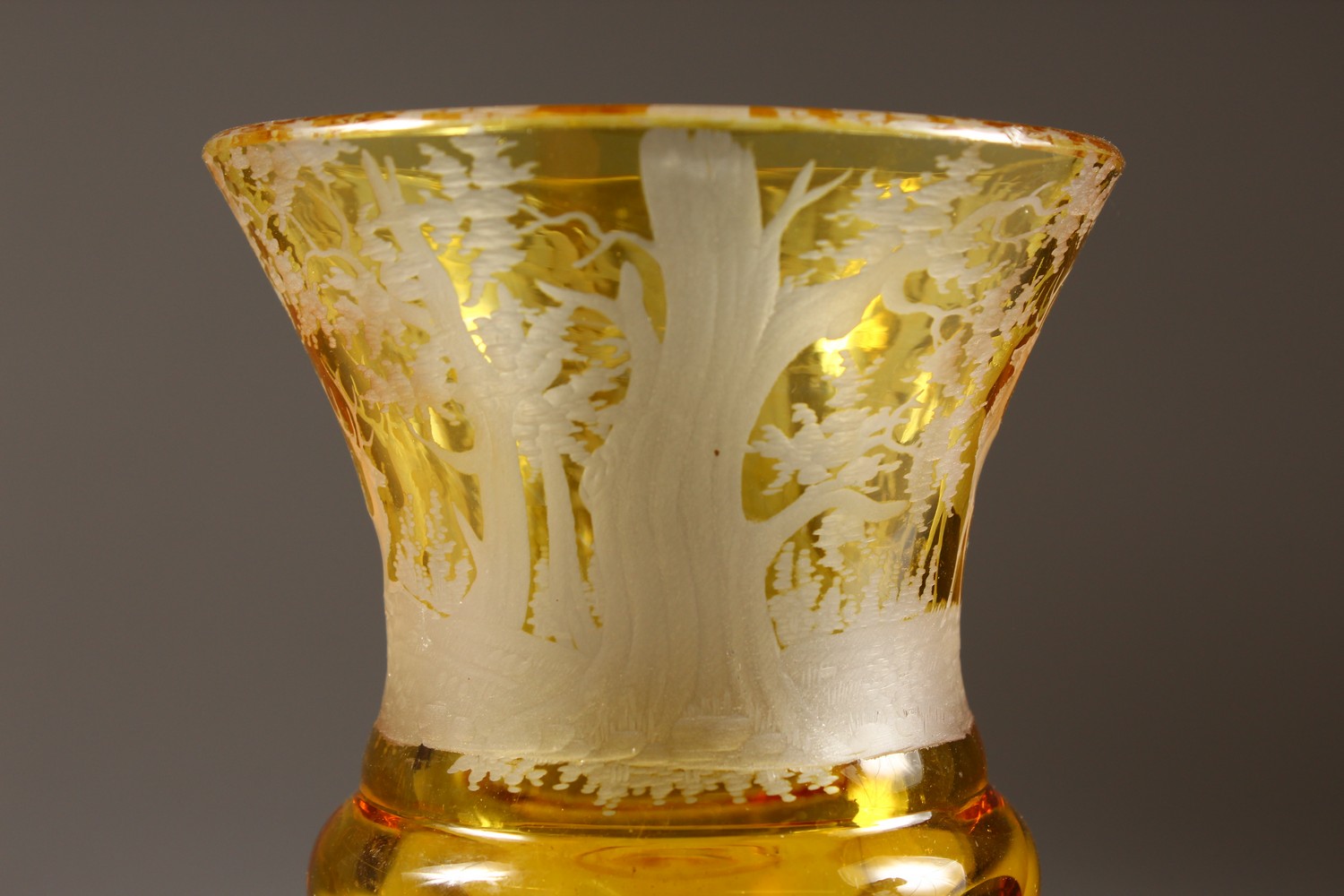 A BOHEMIAN AMBER CUT GOBLET, engraved with deer in a wood. 7ins high. - Image 5 of 6