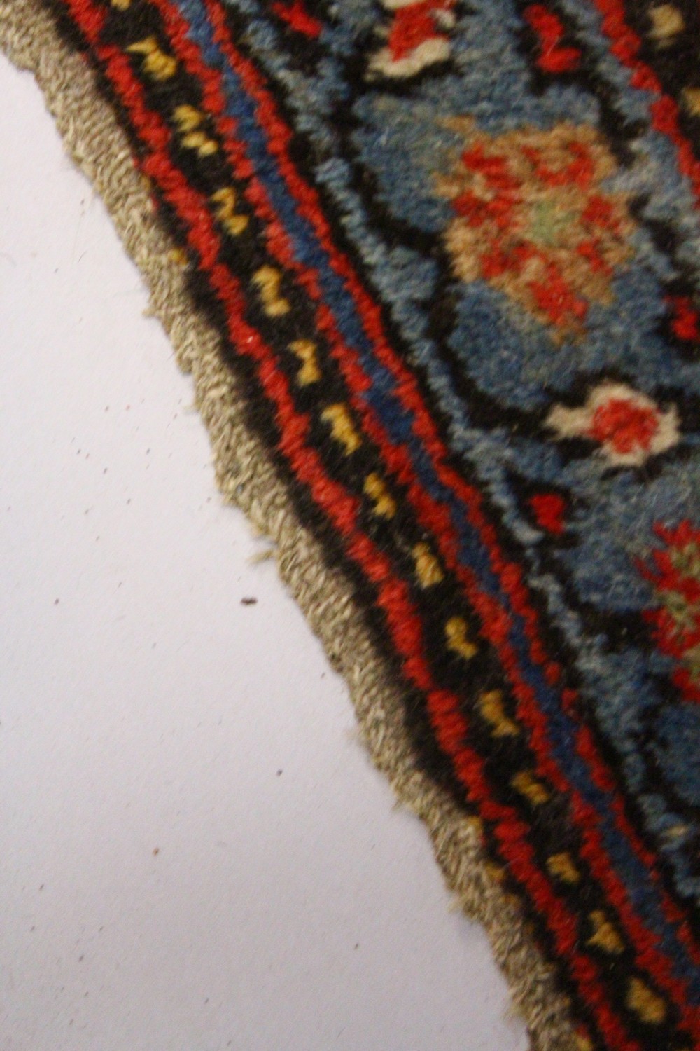 A CAUCASIAN RUG, with six central motifs. 6ft 10ins x 4ft 3ins. - Image 3 of 4