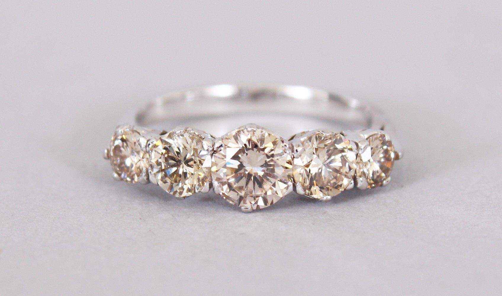 AN 18CT WHITE GOLD FIVE STONE GRADUATED DIAMOND RING of 2cts approx.