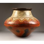 A PERUVIAN SHIPIBO CULTURE CIRCULAR POT, with zigzag pattern. 36cms high x 44cms diameter.