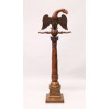 A 19TH CENTURY CARVED FRUITWOOD LECTURN, the book support carved as an eagle with outswept wings