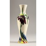 A VASE, with the Solifleur design by Nicola Slaney. 8ins high.