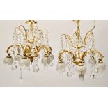 A PAIR OF 20TH CENTURY BRASS AND CUT GLASS CHANDELIERS, with frosted glass shades. 16ins high x
