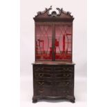 A GEORGE III CHIPPENDALE STYLE MAHOGANY BOOKCASE ON CHEST, the top with shell and "C" scroll