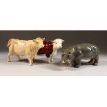 A BESWICK HEREFORD COW, GUERNSEY COW AND A HIPPOPOTAMUS, all 7ins long (3).