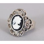 A SILVER AND CAMEO RING.