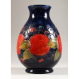 A LARGE VASE, with the pomegranate design, on a blue ground, 1913-Circa. 1925. 9.5ins high.