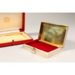 A GOOD CARTIER RIBBED SILVER BOX, with velvet and silver gilt interior, No. L5559. 9cms x 5.75cms,