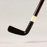 A ROSEWOOD "GOLF PUTTER" WALKING STICK, with ivory collar. 38ins long.
