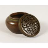 A SMALL CHINESE BRONZE CIRCULAR CENSER AND LID. Signed. 4.5cms diameter.