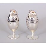 A PAIR OF CHICK PLATE EGG CUP WARMERS.