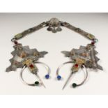 A VERY GOOD ISLAMIC SILVER PENDANT, 23ins long, set with semi-precious stones, coins and enamel.