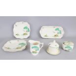 A BESWICK PART BREAKFAST SERVICE, in the Clarice Cliff design, sandwich tray, three plates and two