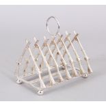 A PLATED TOAST RACK, seven pairs of crossed rifles.