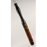 A PAINTED AND GILT DECORATED TURNED WOOD TRUNCHEON. 15.5ins long.