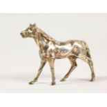 A CAST SILVER MODEL OF A HORSE. 7cms long. Stamped B. M. .925.