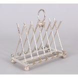 A PLATED TOAST RACK, seven pairs of crossed golf clubs.