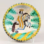 A DELFT POTTERY COLOURED CIRCULAR CHARGER with a portrait of William III on horseback. 13.5ins