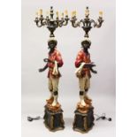 A TALL PAIR OF PAINTED BLACKAMOOR LAMPS, with figures holding six curving light branches on their