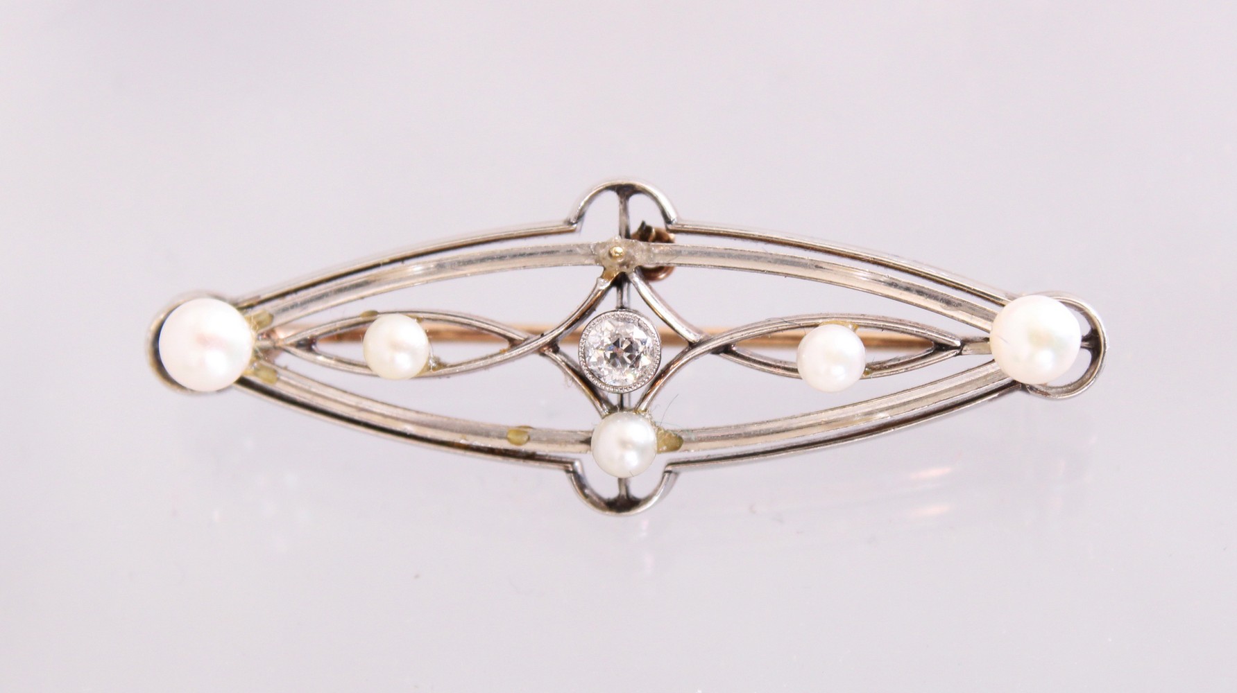 A DIAMOND AND SEED PEARL BROOCH.