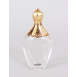 A GOLD TOP GLASS SCENT BOTTLE. 9cms long.