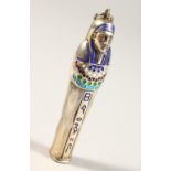 A SMALL SILVER AND ENAMEL EGYPTIAN MUMMY. 5.5cms long.