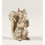 A CAST SILVER MODEL OF A SQUIRREL. 2.25cms long. Stamped .925.