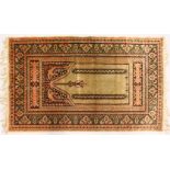 A SMALL PERSIAN PRAYER RUG, signed. 3ft 7ins x 2ft 2ins.