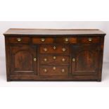 AN 18TH CENTURY OAK DRESSER BASE, with three plank top, the front with four drawers over three