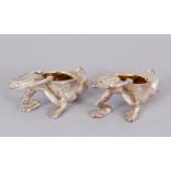 A PAIR OF PLATED FROG SALTS.