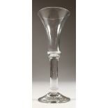 A LARGE GEORGIAN PLAIN STEM WINE GLASS, with inverted bell bowl. 7.25ins high.