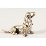 A CAST SILVER MODEL OF A DACHSHUND. 5cms long. Stamped .925.