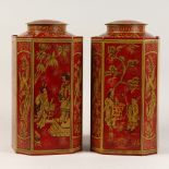 A PAIR OF TALL OCTAGONAL CHINESE DESIGN TEA TINS AND COVERS. 14ins high.