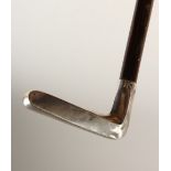 A "GOLF PUTTER" WALKING STICK, with hallmarked silver handle. 34.5ins long.