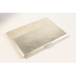 AN ENGINE TURNED SILVER CIGARETTE CASE. 12cms x 8cms. London 1946.