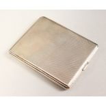 AN ENGINE TURNED SILVER CIGARETTE CASE. 10cms x 8cms. London 1931. Goldsmith & Silversmith Co.