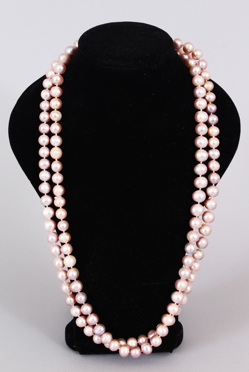 A LONG STRING OF PINK PEARLS.