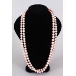 A LONG STRING OF PINK PEARLS.