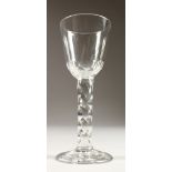 A GEORGIAN WINE GLASS, with facet stem. 5.5ins high.