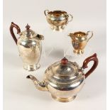 A FOUR PIECE CIRCULAR TEA SET, comprising teapot, hot water jug, sugar basin and milk jug. London