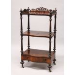 A LATE REGENCY ROSEWOOD THREE TIER SERPENTINE FRONTED WHAT-NOT, with fretwork frieze, single