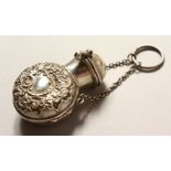 A VICTORIAN SILVER CASED GLASS SCENT BOTTLE AND CHAIN. 5.5cms high. Birmingham 1874.